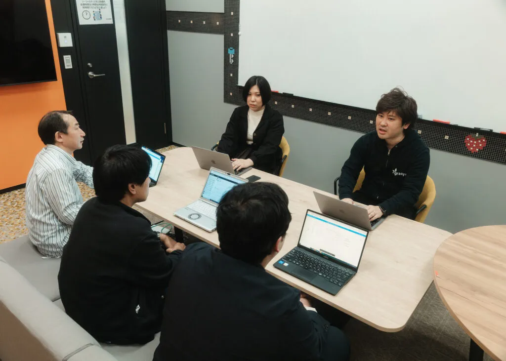 バンダイナムコエンターテインメントとgrasysの担当者による打ち合わせ